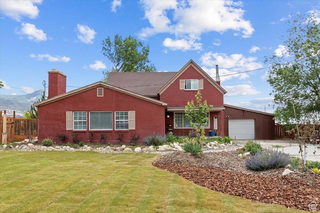 125 W 300 S, Ephraim, UT 84627 - view of front facade with an attached garage, a chimney, brick siding, and driveway