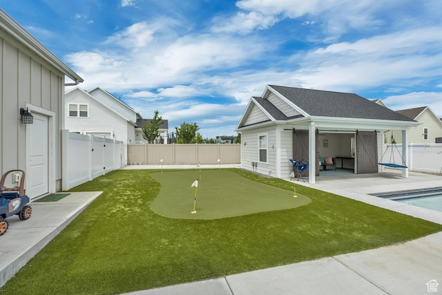 207 S Summer Breeze Ln, Layton, UT 84041 - fenced backyard featuring a putting green and a patio area