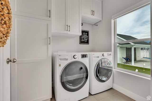 207 S Summer Breeze Ln, Layton, UT 84041 - laundry room with washing machine and clothes dryer, cabinet space, and light tile patterned flooring