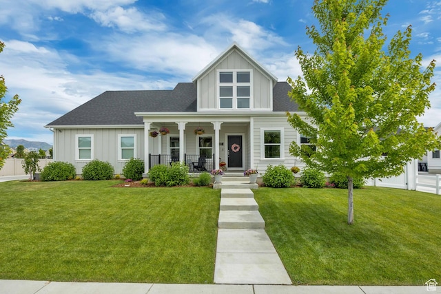 207 S Summer Breeze Ln, Layton, UT 84041 - view of front of house featuring board and batten siding, a porch, and roof with shingles