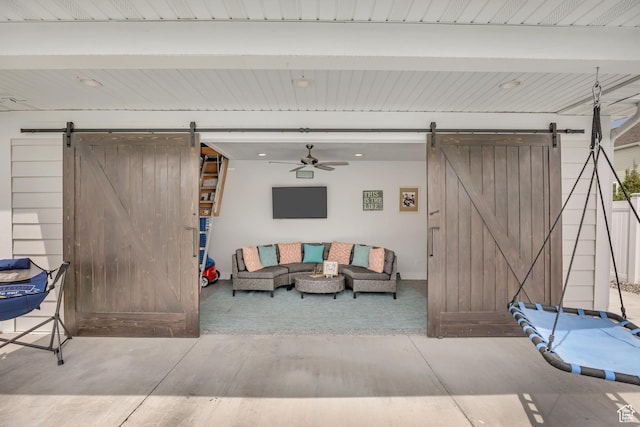 207 S Summer Breeze Ln, Layton, UT 84041 - living area featuring a barn door and a ceiling fan
