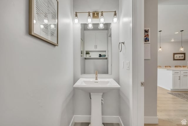 207 S Summer Breeze Ln, Layton, UT 84041 - bathroom with wood finished floors and baseboards