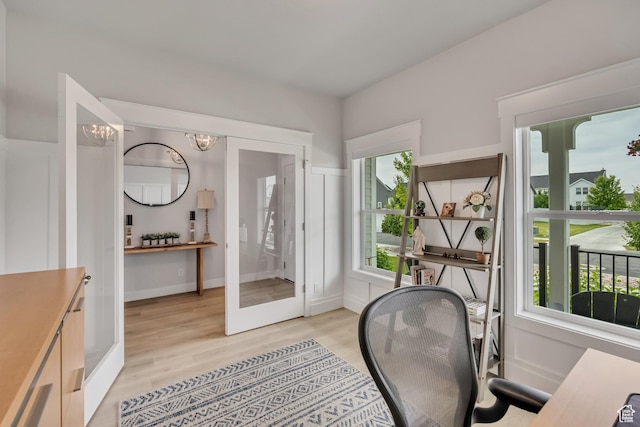 207 S Summer Breeze Ln, Layton, UT 84041 - home office with plenty of natural light, light wood-type flooring, and a chandelier