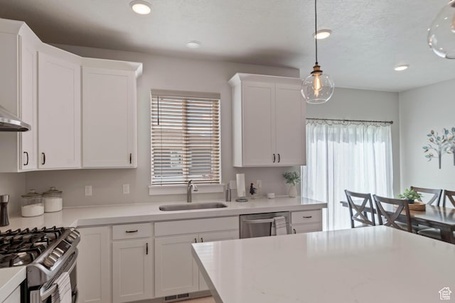 4827 N Sage Dr, Eagle Mountain, UT 84005 - kitchen with a sink, light countertops, white cabinets, and recessed lighting