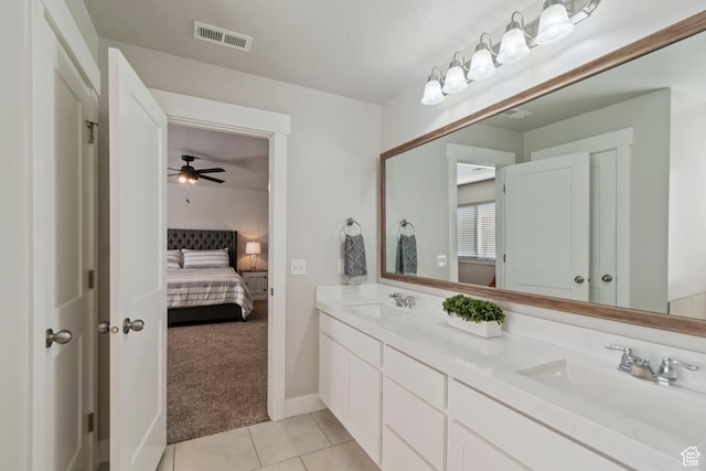 4827 N Sage Dr, Eagle Mountain, UT 84005 - full bathroom with double vanity, connected bathroom, tile patterned floors, ceiling fan, and baseboards