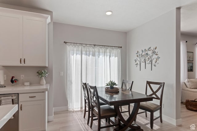 4827 N Sage Dr, Eagle Mountain, UT 84005 - dining room featuring baseboards and light wood-style floors