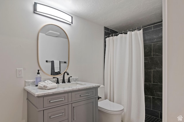 4827 N Sage Dr, Eagle Mountain, UT 84005 - bathroom featuring vanity, toilet, a textured ceiling, and tiled shower