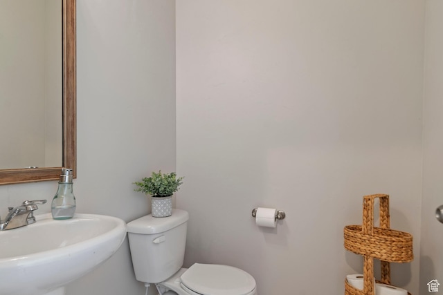 4827 N Sage Dr, Eagle Mountain, UT 84005 - bathroom with a sink, toilet, and baseboards