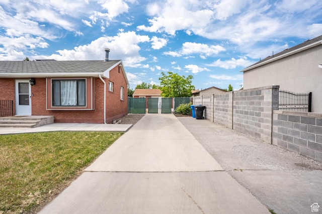 425 W 600 N, Orem, UT 84057 - view of side of home with brick siding, a shingled roof, and driveway