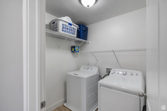 78 W Wildflower Dr, Saratoga Springs, UT 84045 - laundry room featuring separate washer and dryer, baseboards, and a textured ceiling