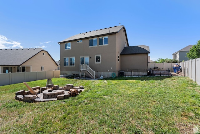 78 W Wildflower Dr, Saratoga Springs, UT 84045 - rear view of house featuring a fire pit and stucco siding