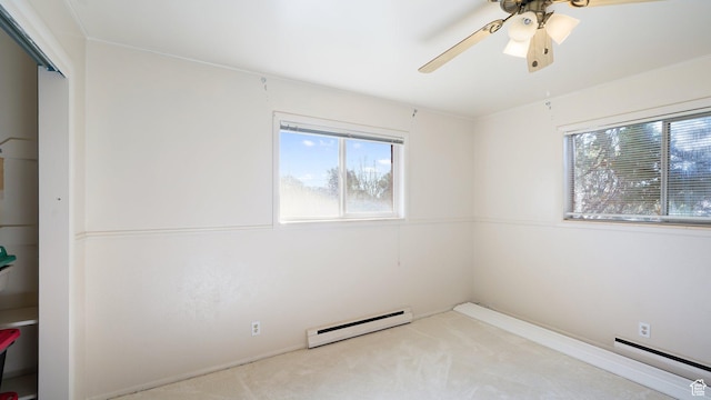 143 E 100 N, Gunnison, UT 84634 - empty room featuring a baseboard radiator, baseboard heating, healthy amount of natural light, and carpet flooring