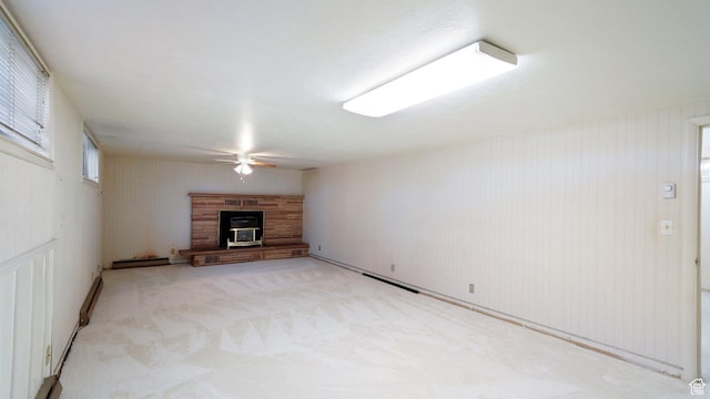 143 E 100 N, Gunnison, UT 84634 - unfurnished living room with ceiling fan, a glass covered fireplace, and light carpet