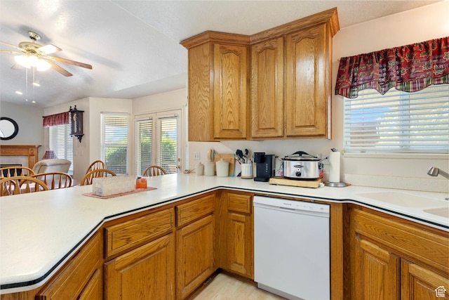 1202 N 2155 W, Clinton, UT 84015 - kitchen featuring white dishwasher, ceiling fan, light countertops, and healthy amount of natural light