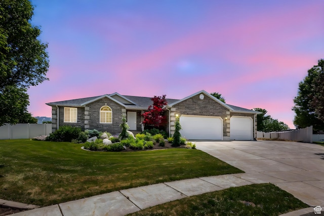 1202 N 2155 W, Clinton, UT 84015 - ranch-style house with concrete driveway, an attached garage, and stone siding