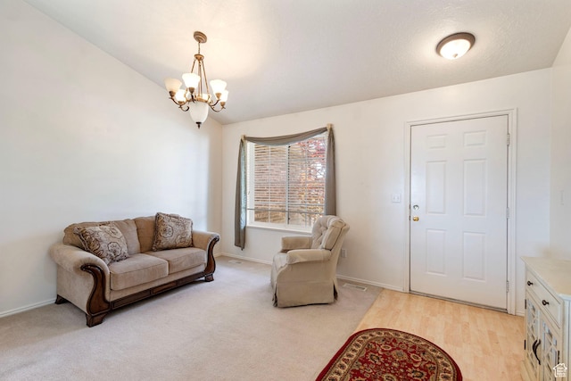 1202 N 2155 W, Clinton, UT 84015 - living area with a chandelier, baseboards, vaulted ceiling, and light colored carpet