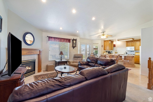 1202 N 2155 W, Clinton, UT 84015 - living area with a premium fireplace, a ceiling fan, lofted ceiling, and recessed lighting