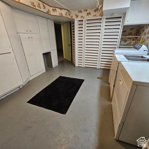 385 E 300 N, Spanish Fork, UT 84660 - kitchen with washer and clothes dryer, white cabinetry, light countertops, and concrete floors