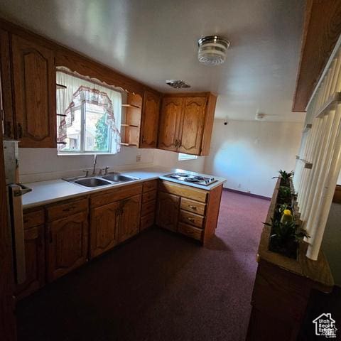 385 E 300 N, Spanish Fork, UT 84660 - kitchen with a sink, dark carpet, stainless steel gas cooktop, brown cabinetry, and light countertops