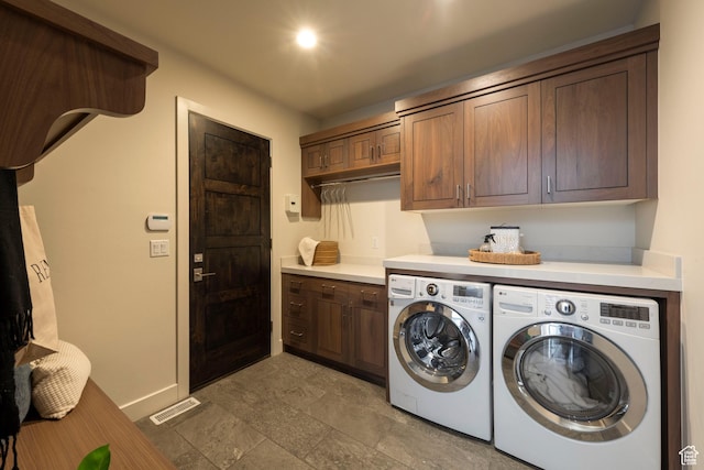 6650 Golden Bear Loop, Park City, UT 84098 - laundry room with cabinet space, washer and clothes dryer, and light stone finish floors