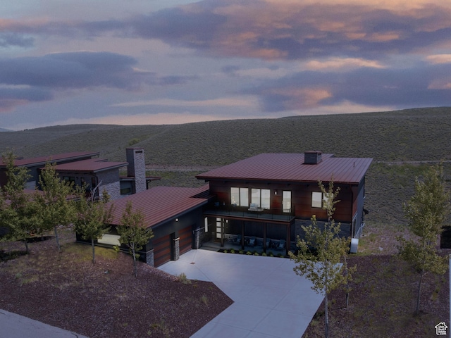 6650 Golden Bear Loop, Park City, UT 84098 - view of front of house with driveway, a chimney, a standing seam roof, and a metal roof