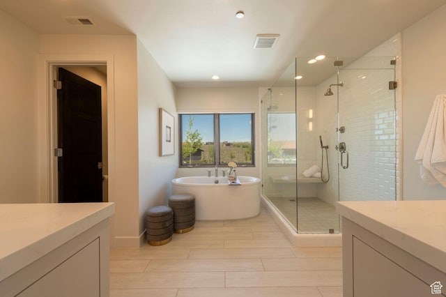 6650 Golden Bear Loop, Park City, UT 84098 - bathroom with a shower stall, a freestanding tub, recessed lighting, and vanity