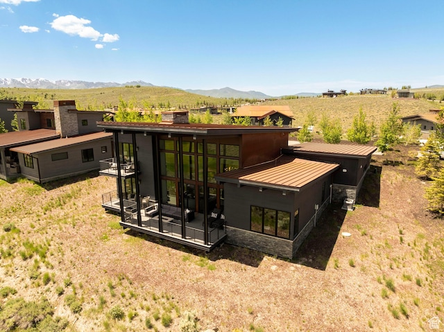 6650 Golden Bear Loop, Park City, UT 84098 - back of house with a mountain view, stone siding, a chimney, a standing seam roof, and a metal roof