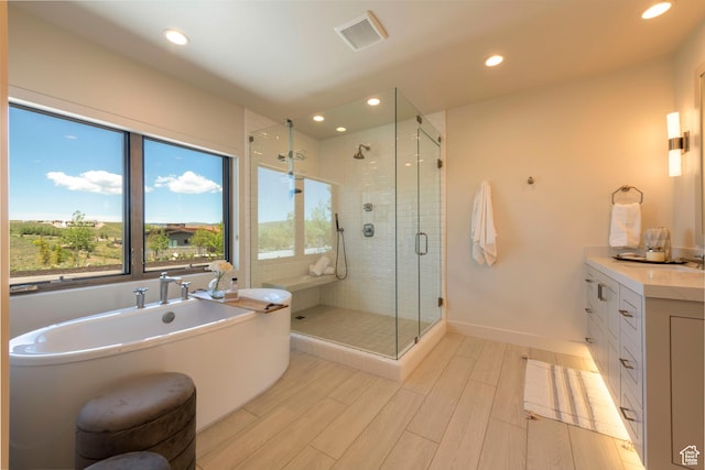 6650 Golden Bear Loop, Park City, UT 84098 - bathroom featuring a soaking tub, a shower stall, wood finished floors, vanity, and recessed lighting