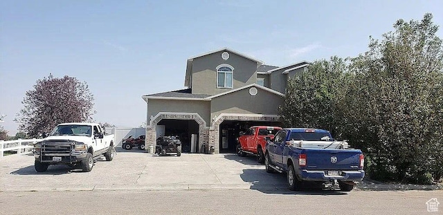 1559 S 2950 W, Vernal, UT 84078 - view of front of home with stucco siding, driveway, and stone siding