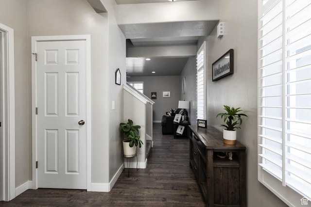 7709 N Seabiscuit Rd, Eagle Mountain, UT 84005 - hallway with dark wood-type flooring, baseboards, and stairway
