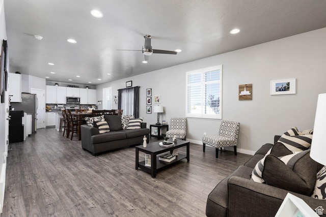 7709 N Seabiscuit Rd, Eagle Mountain, UT 84005 - living area featuring ceiling fan, dark wood finished floors, recessed lighting, and baseboards
