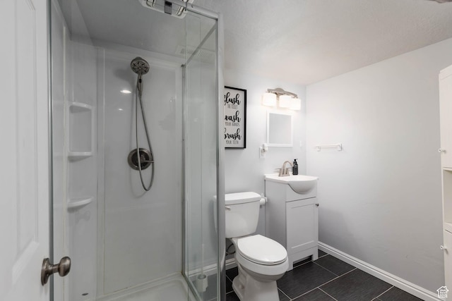 7709 N Seabiscuit Rd, Eagle Mountain, UT 84005 - full bathroom featuring a shower stall, vanity, toilet, tile patterned floors, and baseboards