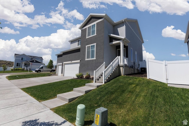 7709 N Seabiscuit Rd, Eagle Mountain, UT 84005 - view of front of house with a garage, concrete driveway, stucco siding, and central AC