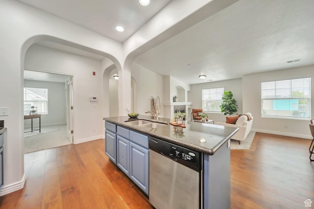 11738 S Currant Dr Unit 112, South Jordan, UT 84009 - kitchen featuring dishwasher, arched walkways, a sink, open floor plan, and recessed lighting