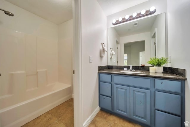11738 S Currant Dr Unit 112, South Jordan, UT 84009 - bathroom with vanity, tub / shower combination, baseboards, and tile patterned floors