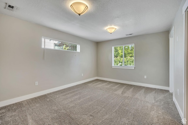 133 E Commonwealth Ave S, South Salt Lake, UT 84115 - carpeted spare room with a textured ceiling and baseboards