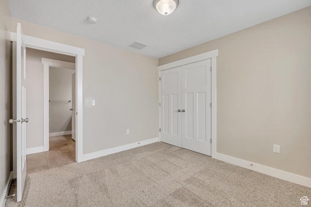 133 E Commonwealth Ave S, South Salt Lake, UT 84115 - unfurnished bedroom featuring a closet, carpet, and baseboards