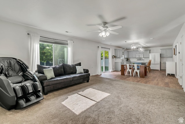 856 S 1580 W, Lehi, UT 84043 - living room featuring light colored carpet, healthy amount of natural light, and ceiling fan