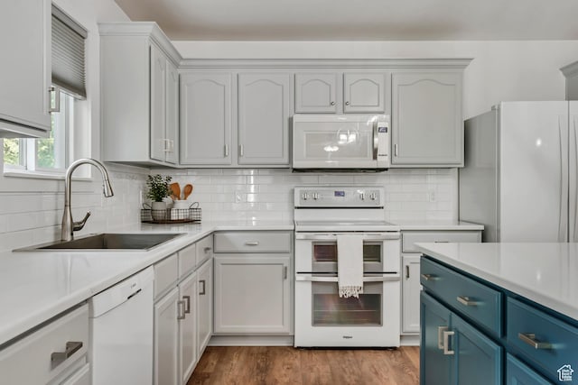 856 S 1580 W, Lehi, UT 84043 - kitchen with white appliances, a sink, blue cabinets, and light countertops