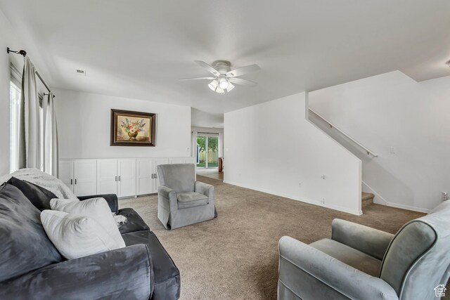 856 S 1580 W, Lehi, UT 84043 - living room featuring a ceiling fan, stairway, light colored carpet, and baseboards