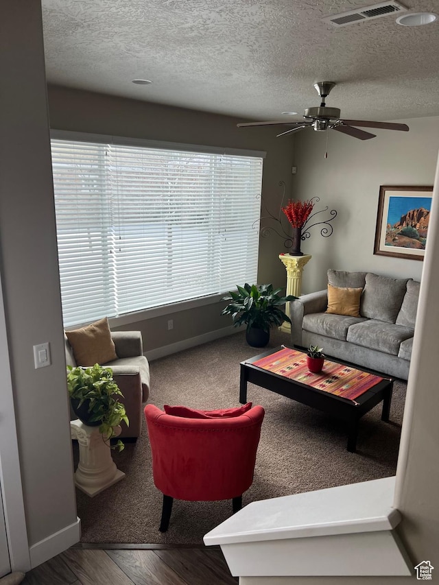 9681 S Zakro Ln, South Jordan, UT 84095 - living area featuring a ceiling fan, baseboards, a textured ceiling, and wood finished floors