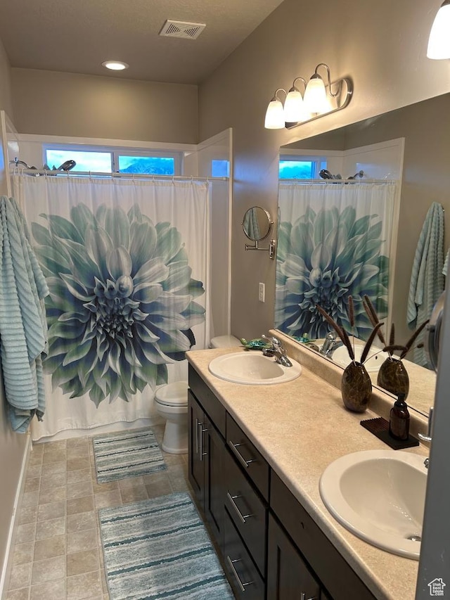 9681 S Zakro Ln, South Jordan, UT 84095 - bathroom featuring double vanity and curtained shower
