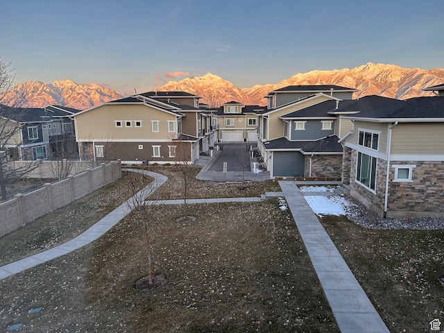 9681 S Zakro Ln, South Jordan, UT 84095 - rear view of house featuring a mountain view, a residential view, and stone siding