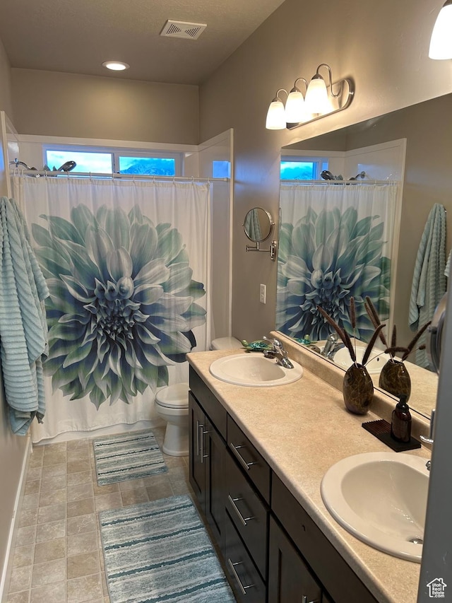 9681 S Zakro Ln, South Jordan, UT 84095 - full bathroom featuring double vanity, toilet, and a shower with curtain
