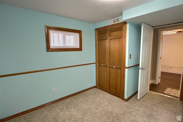 3600 S 6580 W, West Valley City, UT 84128 - unfurnished bedroom featuring a closet, baseboards, and carpet