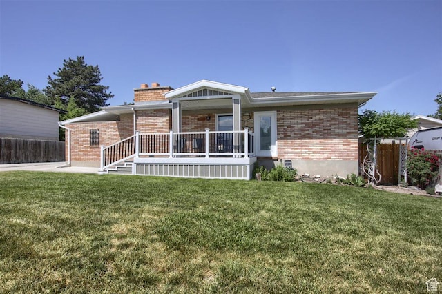 3600 S 6580 W, West Valley City, UT 84128 - ranch-style house featuring brick siding, a chimney, and a porch