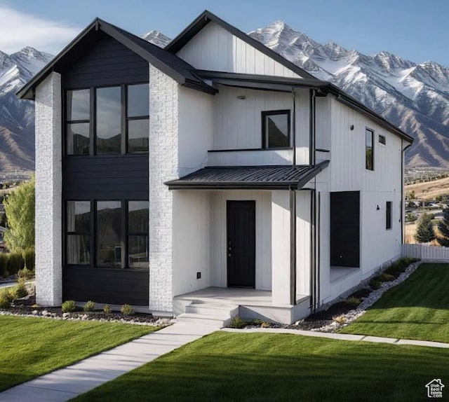 10733 N Dosh Ln Unit 12, Highland, UT 84003 - view of front of property featuring a mountain view, a standing seam roof, and a front lawn