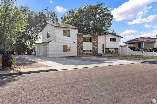 480 S 1160 W, Orem, UT 84058 - view of front facade featuring an attached garage, driveway, and stone siding