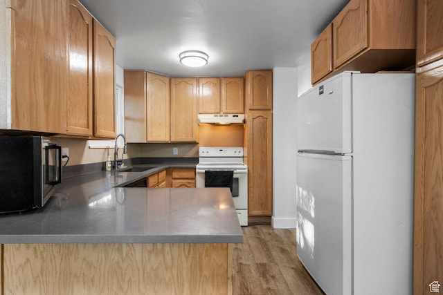 480 S 1160 W, Orem, UT 84058 - kitchen with white appliances, a sink, under cabinet range hood, a peninsula, and light wood-style flooring