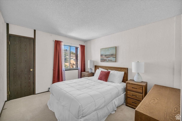 407 S Vasels Rd Unit 27, Brian Head, UT 84719 - bedroom with light colored carpet and a textured ceiling
